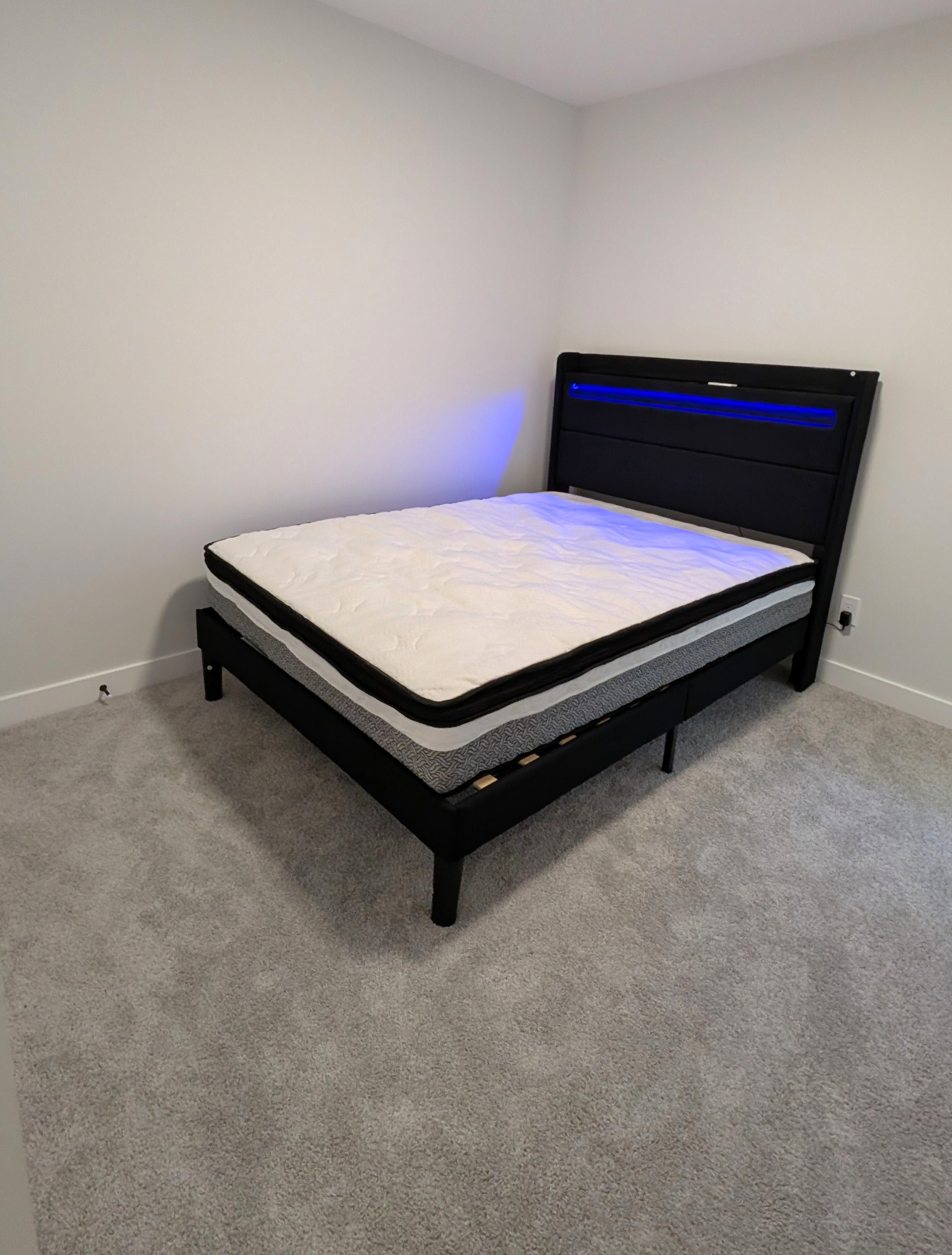 Upholstered bed assembled with LED headboard in Calgary.