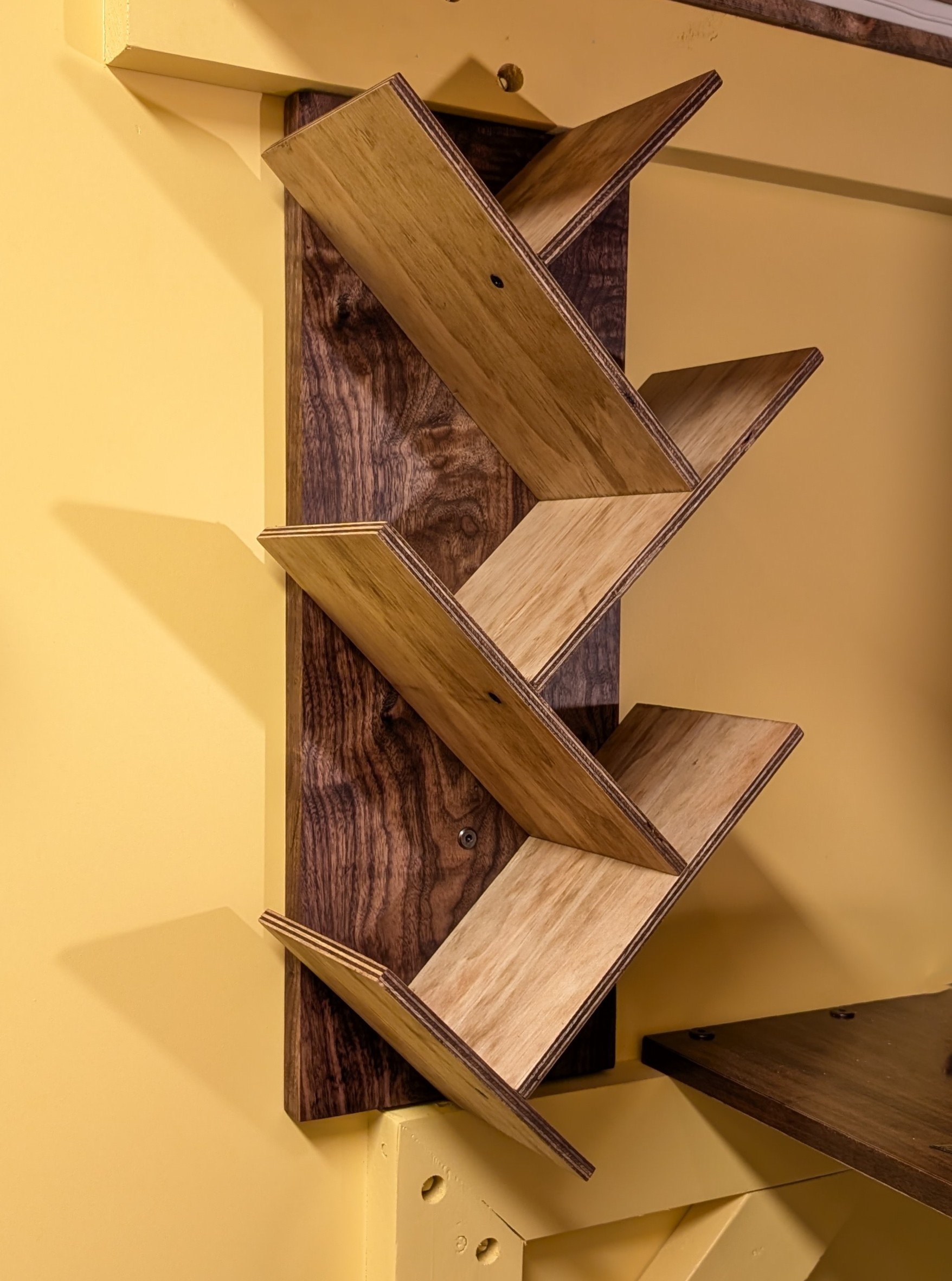 Custom zigzag bookshelf built and installed in Calgary SW.