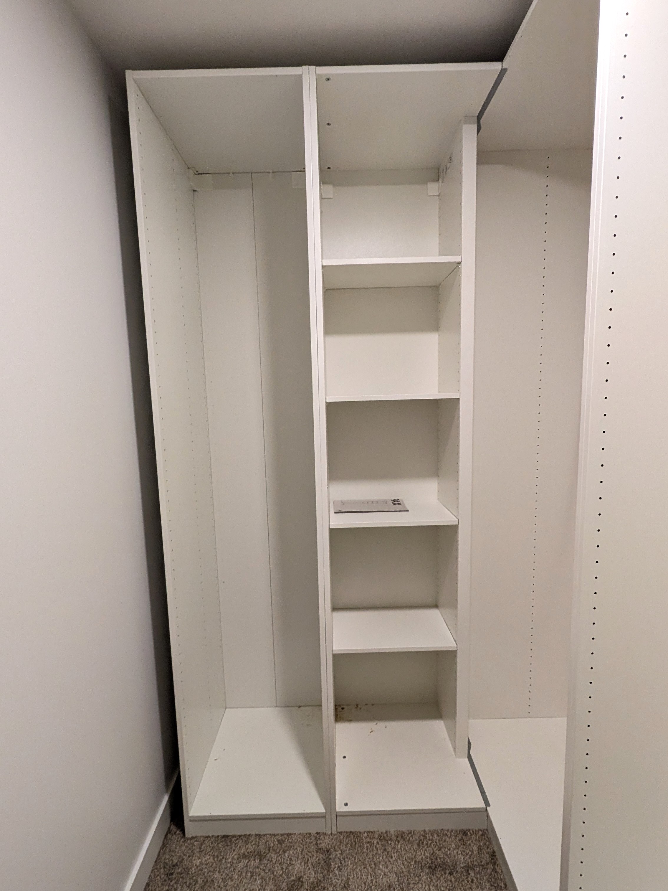 IKEA PAX wardrobe installed and aligned.