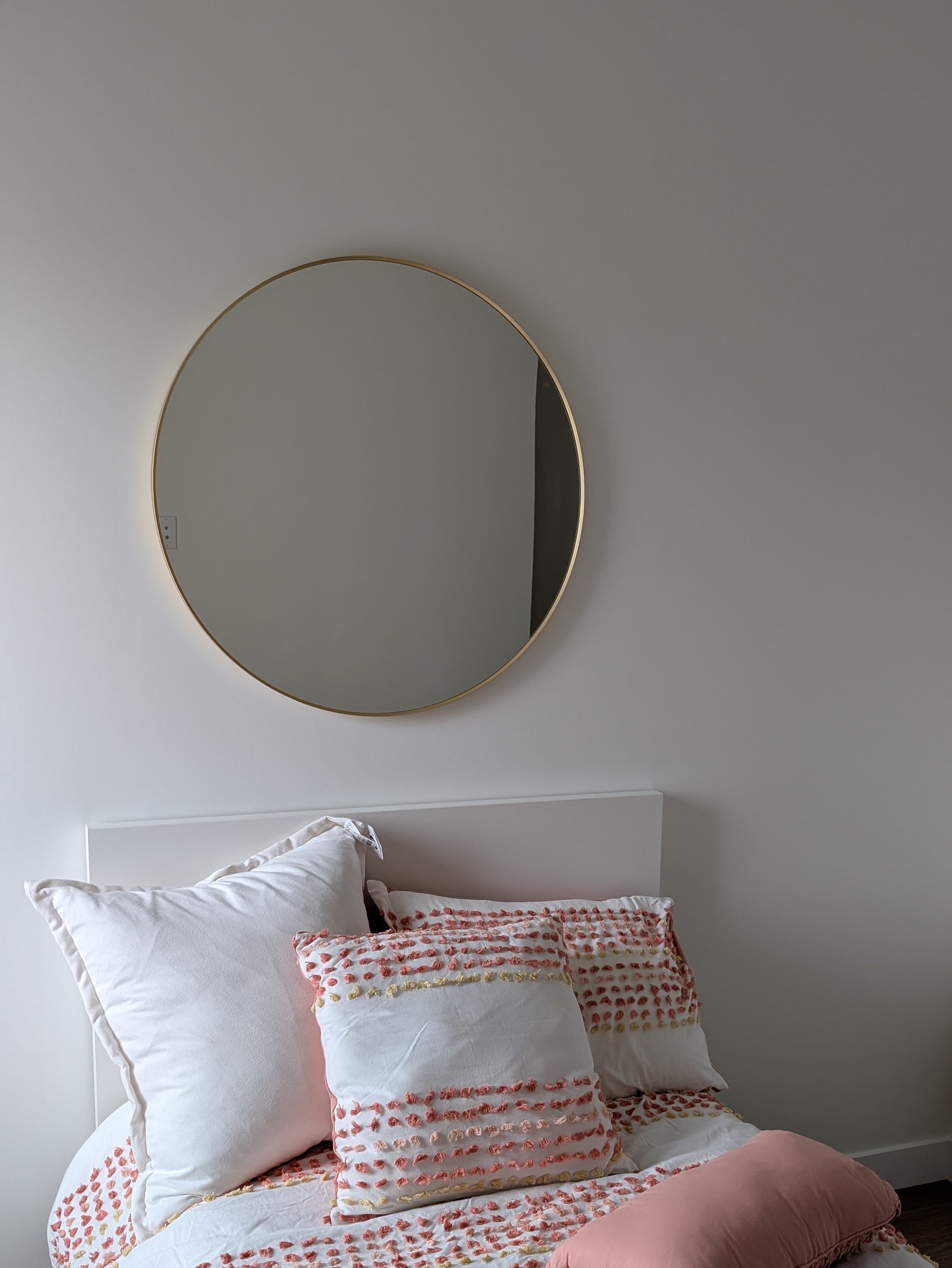 Round mirror mounted in Calgary NW.